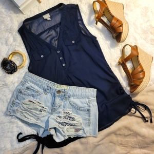 Sheer blue sleeveless blouse